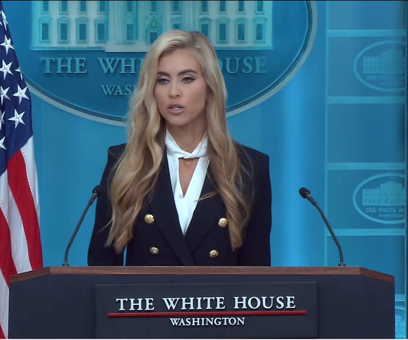 Katie Zacharia at the podium during her first press briefing as White House press secretary